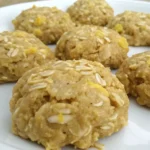 Close-up of freshly made lemon oatmeal no bake cookies arranged on a white plate.