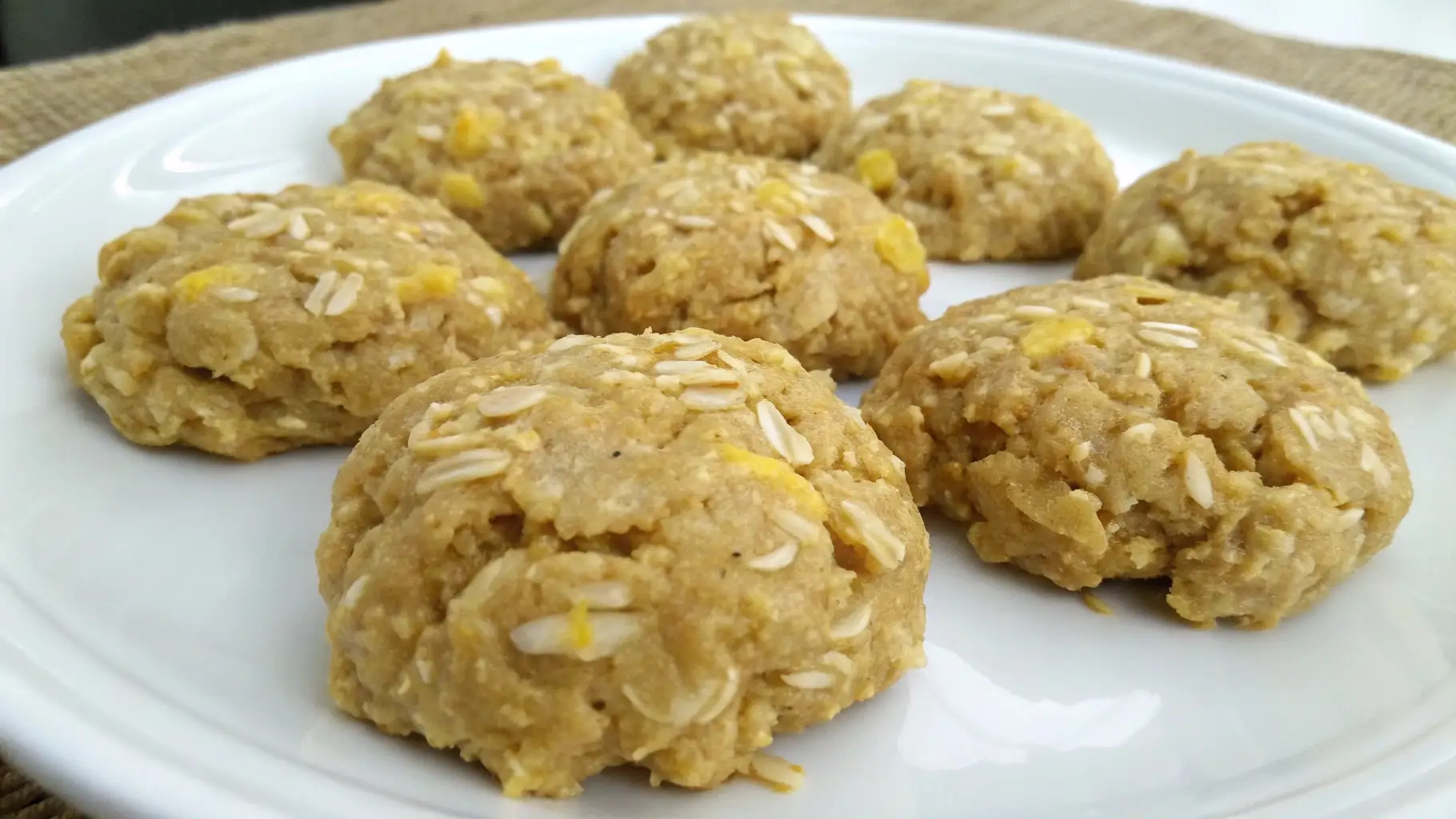 Plate of homemade lemon oatmeal no bake cookies with visible oats and a light golden color.