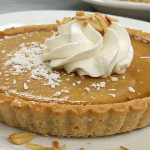 Quick 5 Ingredient No Bake Pies for Easy Desserts - Simple, Sweet, and Ready Fast 2 5 ingredient no bake pie with graham cracker crust topped with whipped cream and coconut flakes on a white plate