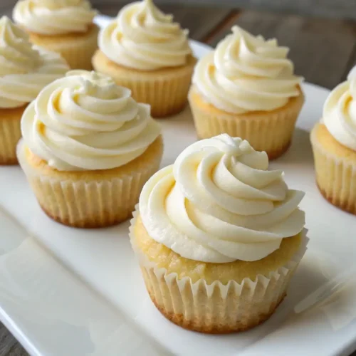 Mini Cupcakes Recipe Easy Bite Size Dessert for Parties - Simple, Fun, and Crowd-Pleasing 2 Mini vanilla cupcakes with smooth buttercream frosting arranged on a white serving plate