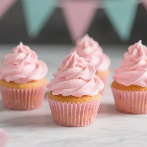 Pink Cupcakes With Buttercream Frosting for Parties – Bright, Fun, and Easy 2 Pink cupcakes with soft vanilla base and creamy pink buttercream frosting on a light background